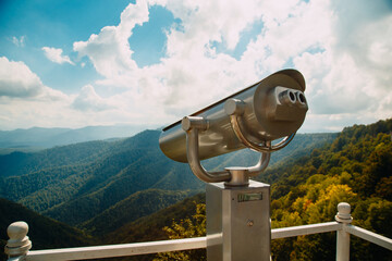 Coin Operator Binocular viewer Landscape with a beautiful cloudy sky and mountains ..