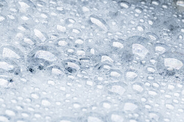 Foam bubble from soap or shampoo for washing isolated on white background from above