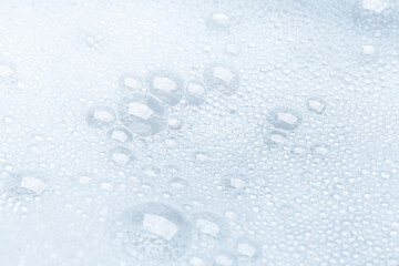 Background of soap foam and bubbles on a white background, macro photography