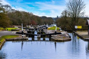 Looking down the staircase of lock gates at Hatton Locks towards Warwick, UK in the distance on a winters day