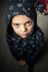 Portrait of happy little cool boy  wearing hooded sweatshirt.