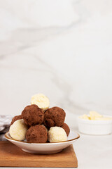 Homemade Indian round vegetarian sweets. Coconut and cocoa balls
