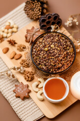 Kutia is a wheat Christmas porridge.  Traditional Christmas dish of the Slavs. Kutia with raisins, nuts, poppy and honey on dark background. Top view. Christmas atmosphere. 