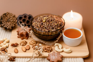 Kutia is a wheat Christmas porridge.  Traditional Christmas dish of the Slavs. Kutia with raisins, nuts, poppy and honey on dark background. Top view. Christmas atmosphere. 