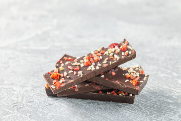Chocolate with dried raspberries and nuts. Healthy sweets