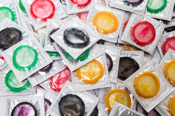 Colorful condoms background.