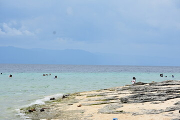 A Rocky Sandy Coastline And Ocean