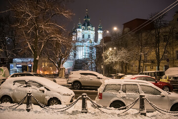 Evening snowy view of St. Andrew Church from Desyatynna Street in Kyiv, Ukraine. December 2020