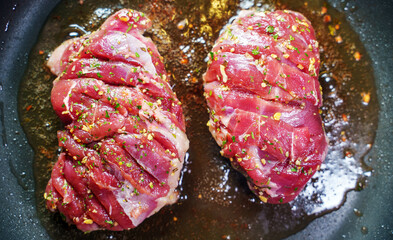 Duck fillet is cooked in a skillet.