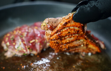 Duck fillet is cooked in a skillet.