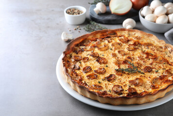 Delicious homemade mushroom pie on grey table
