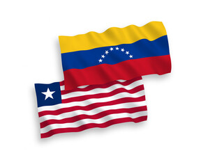 National vector fabric wave flags of Venezuela and Liberia isolated on white background. 1 to 2 proportion.