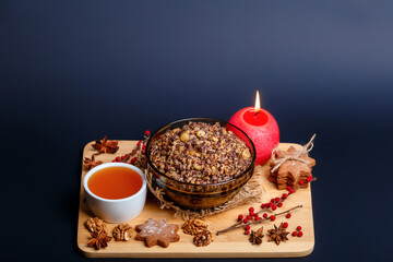 Christmas kutia with honey, walnuts, raisins and poppy. Christmas eve food. Christmas atmosphere.