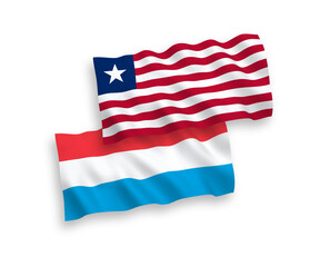 National vector fabric wave flags of Liberia and Luxembourg isolated on white background. 1 to 2 proportion.