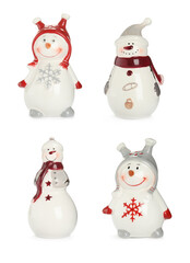 Set with funny ceramic snowmen on white background