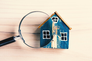 House Model Seen Through Magnifying Glass