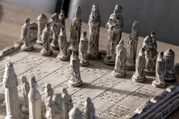 A portrait of a pawn standing in front of the rest of the army, ready to start the strategic duel...