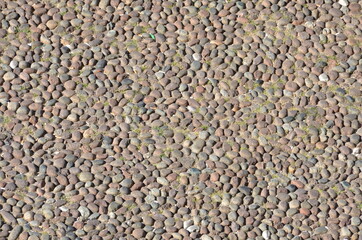 Pavement made of river gravel seen on an Italian street