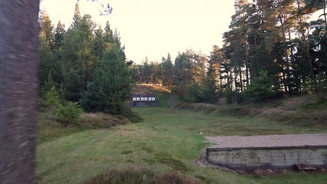 Shooting range. Flying a path in the trees.
