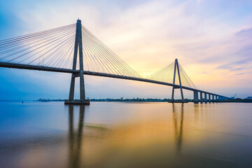 Rach Mieu cable-stayed bridge over Mekong River in sunrise, Tien Giang province, Vietnam.	
