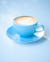 Beautiful latte coffee cup on white table