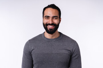 Smiling arab man in casual attire isolated over white background