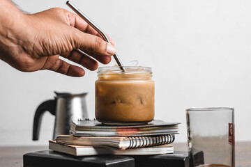Iced coffee with metal straw