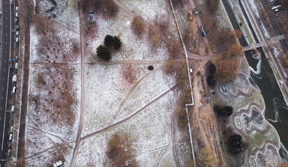 A view from a height of the snow-covered city park