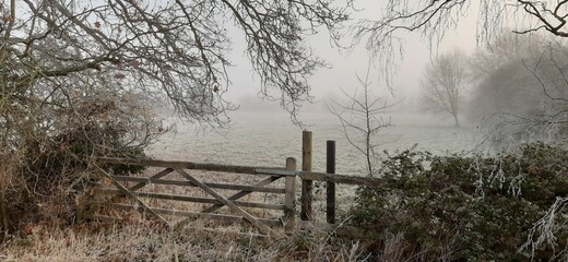 gated access to a farmers field on a frosty morning