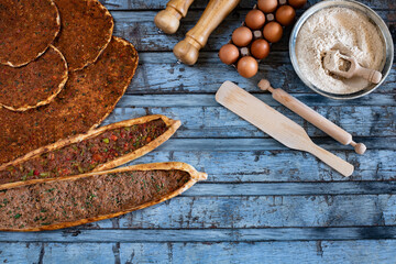 Traditional Turkish food, lahmacun and kiymali and kusbasili pide. Many kinds of traditional food on the rustic table. 