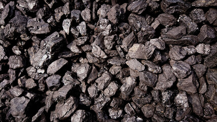 Fine charcoal for heating is dumped in a big pile