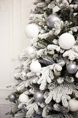 Christmas tree with white and silver balls and garlands