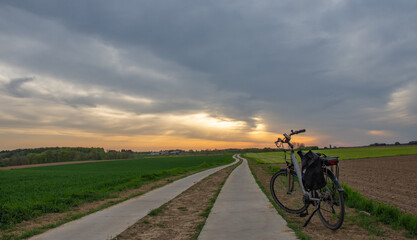 Fototapeta premium Bike and bicycle path at sunrise in Flemish Brabant in Belgium 
