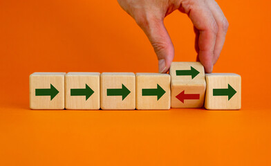 Business concept, arrow in one direction and one red arrow facing opposite direction. The different...