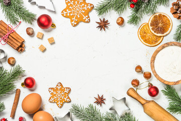 Christmas baking background on white table. Ingredient for cooking christmas pastry, cookies or pie. Top view with copy space.