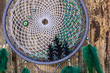 Handmade dream catcher with feathers threads and beads rope hanging