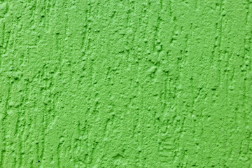 Detail einer neongrünen Wand mit Struktur. Strukturmuster einer grünen Mauer mit Struktur