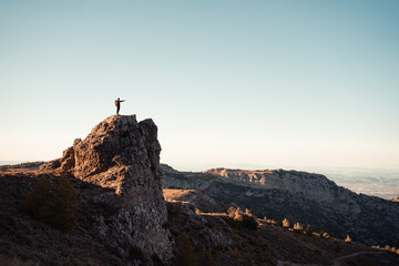 Man in the mountain at sunset. Guy practicing trekking