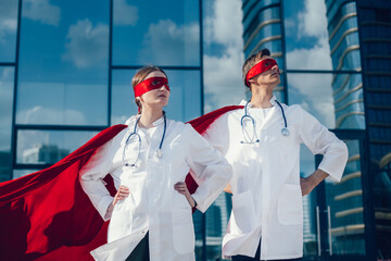 close up. doctors are superheroes standing on a city street .