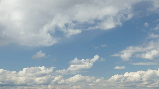 Clouds running in the blue sky timelapse