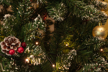 Obraz na płótnie Canvas Christmas tree with decorations near with lights