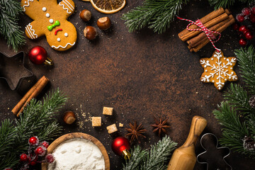 Christmas baking background at dark table. Ingredient for cooking christmas cookies or pie. Top view with copy space.