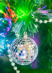 Shiny Christmas ball and decorations hanging on a Christmas tree