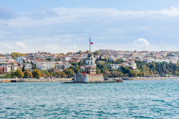 Obraz premium Maiden's Tower or Leander's Tower (Kizkulesi) in Bosphorus strait on a sunny day with background cloudy sky, Istanbul, Turkey