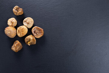 dried figs. fruit on a stone slab. copy space