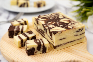 Steamed marble chocolate cheesecake served in white plate