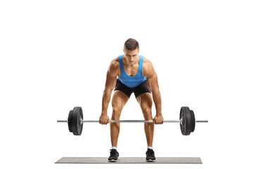 Fototapeta na wymiar Strong young man in sportswear lifting weights