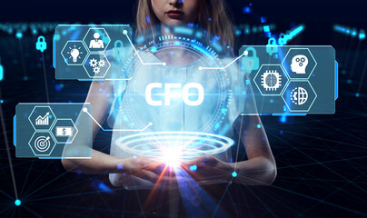Business, Technology, Internet and network concept. Young businessman working on a virtual screen of the future and sees the inscription: CFO
