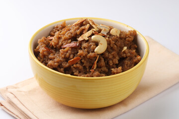 South Indian Sweet pongal made from rice, milk, jaggery and dry fruits.coconutsweet pongal