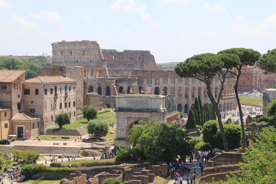 Horizontal image of the Roman Forum with Colosseum in the background.  